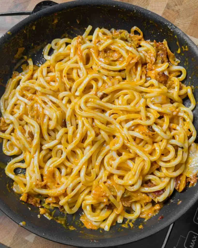 Udon noodles added to the creamy kimchi sauce - GENIUS EATS Udon noodles added to the creamy kimchi sauce