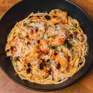 Shrimp spaghetti topped with chili crisp and grated cheese