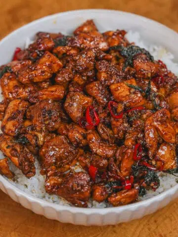 Glazed basil chicken with red chilies served over rice - GENIUS EATS Glazed basil chicken with red chilies served over rice