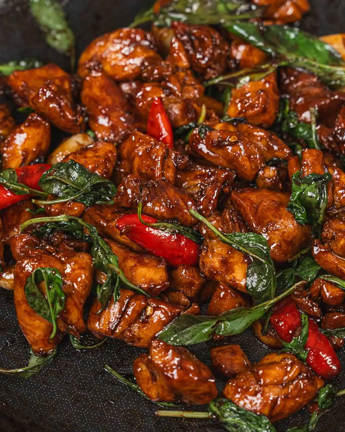 Glazed basil chicken stir-fry with red chilies and garlic cooked to a glossy finish. - GENIUS EATS Taiwanese chicken dish