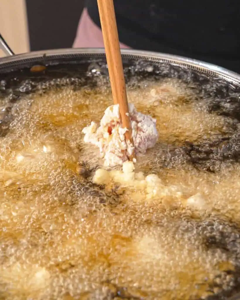 Chicken karaage pieces coated generously in potato starch - GENIUS EATS Chicken karaage pieces coated generously in potato starch
