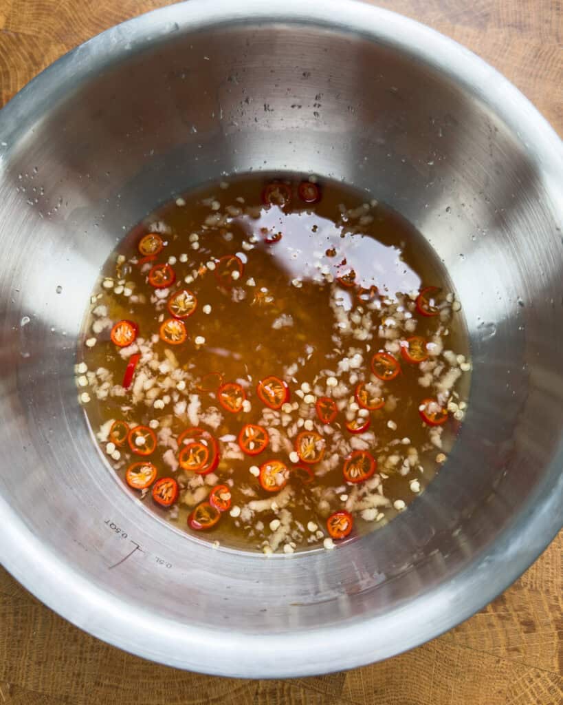 Fish sauce marinade with sliced red chilies for Vietnamese pork chops