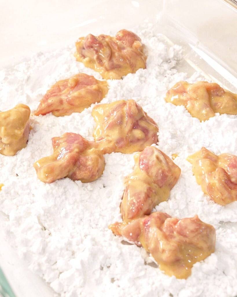 Mixing chicken karaage marinade until evenly coated and sticky - GENIUS EATS Mixing chicken karaage marinade until evenly coated and sticky