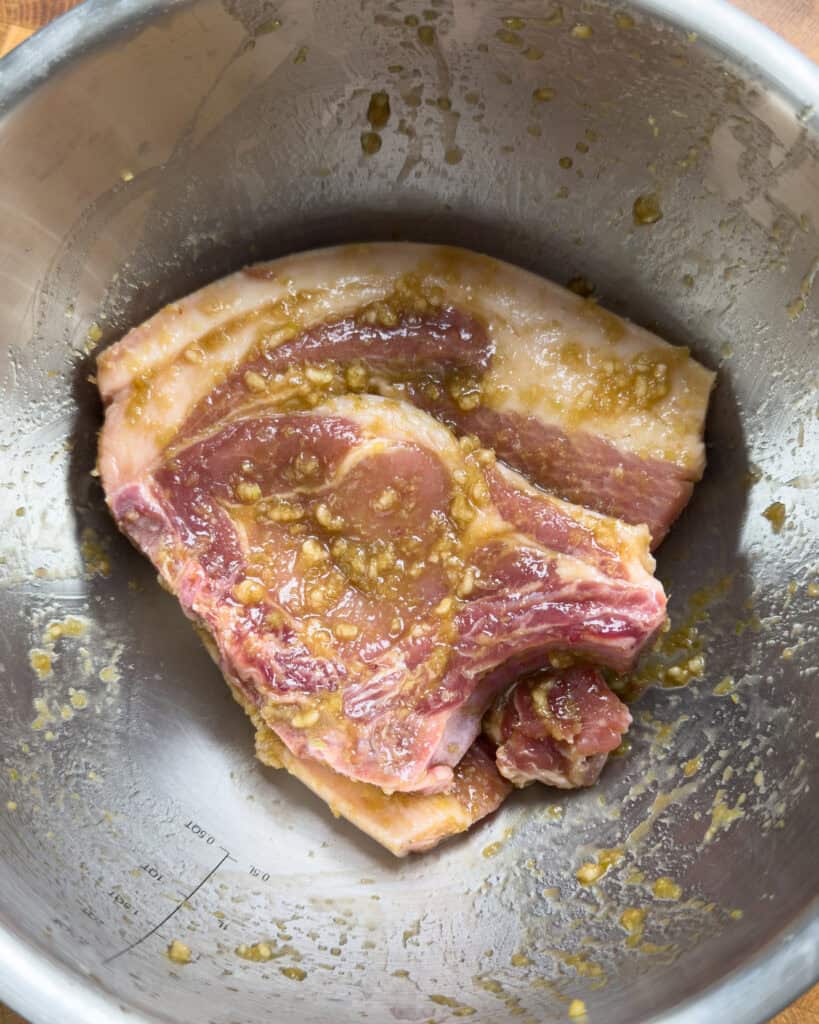 Pork chops marinating in lemongrass garlic fish sauce marinade