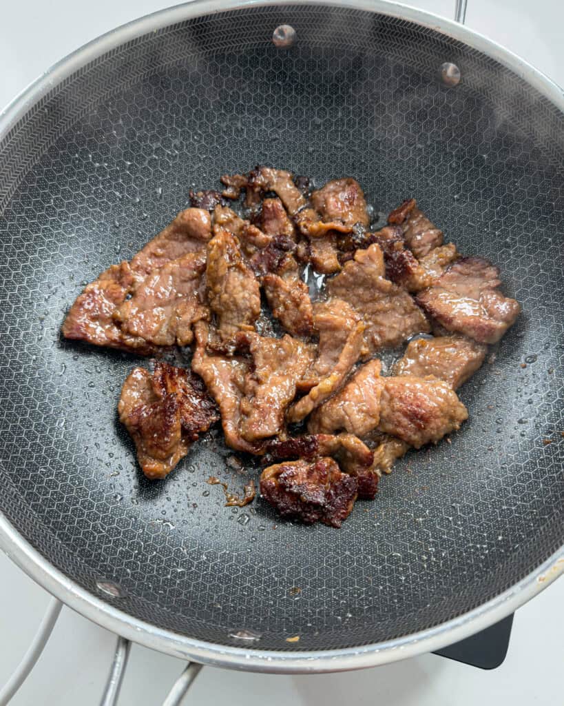 Beef cooked in pan for Mongolian Beef Noodles