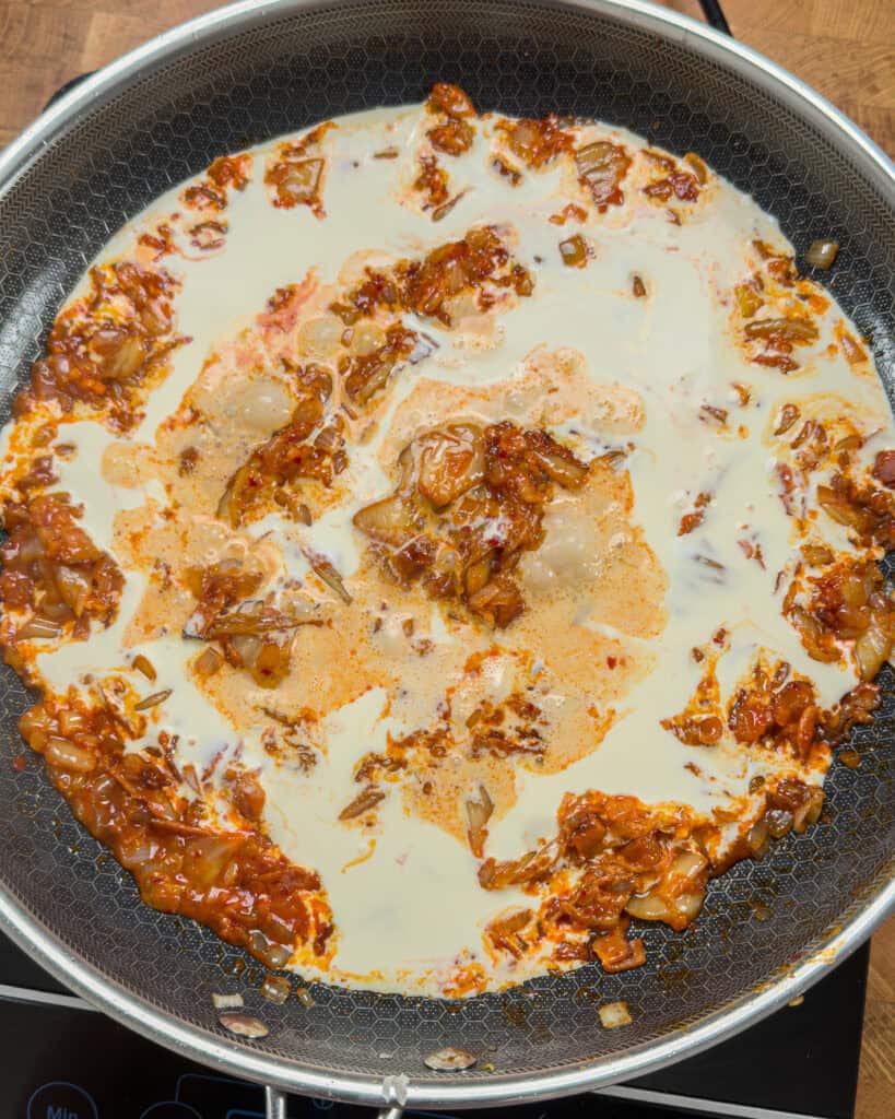 Creamy liquid added to pan mixture after paste stage