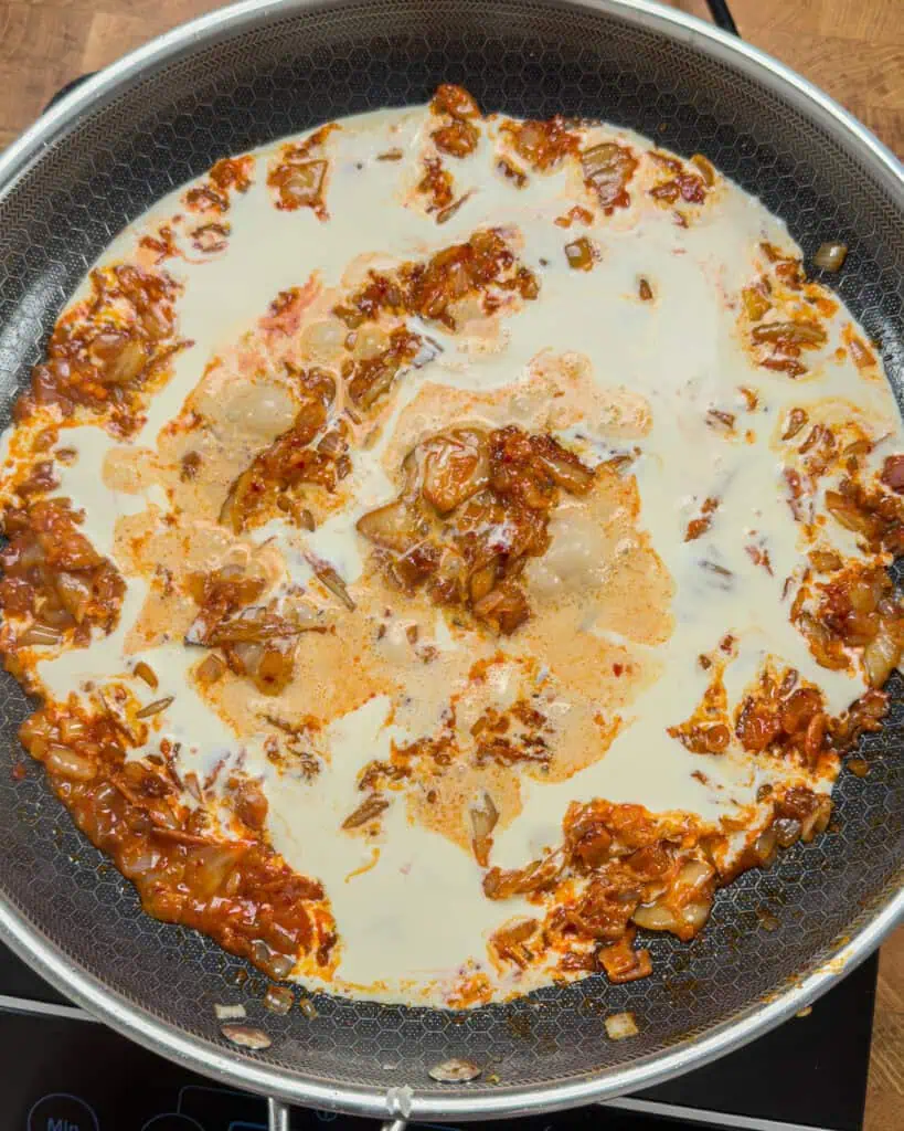 Creamy liquid added to pan mixture after paste stage - GENIUS EATS Creamy liquid added to pan mixture after paste stage