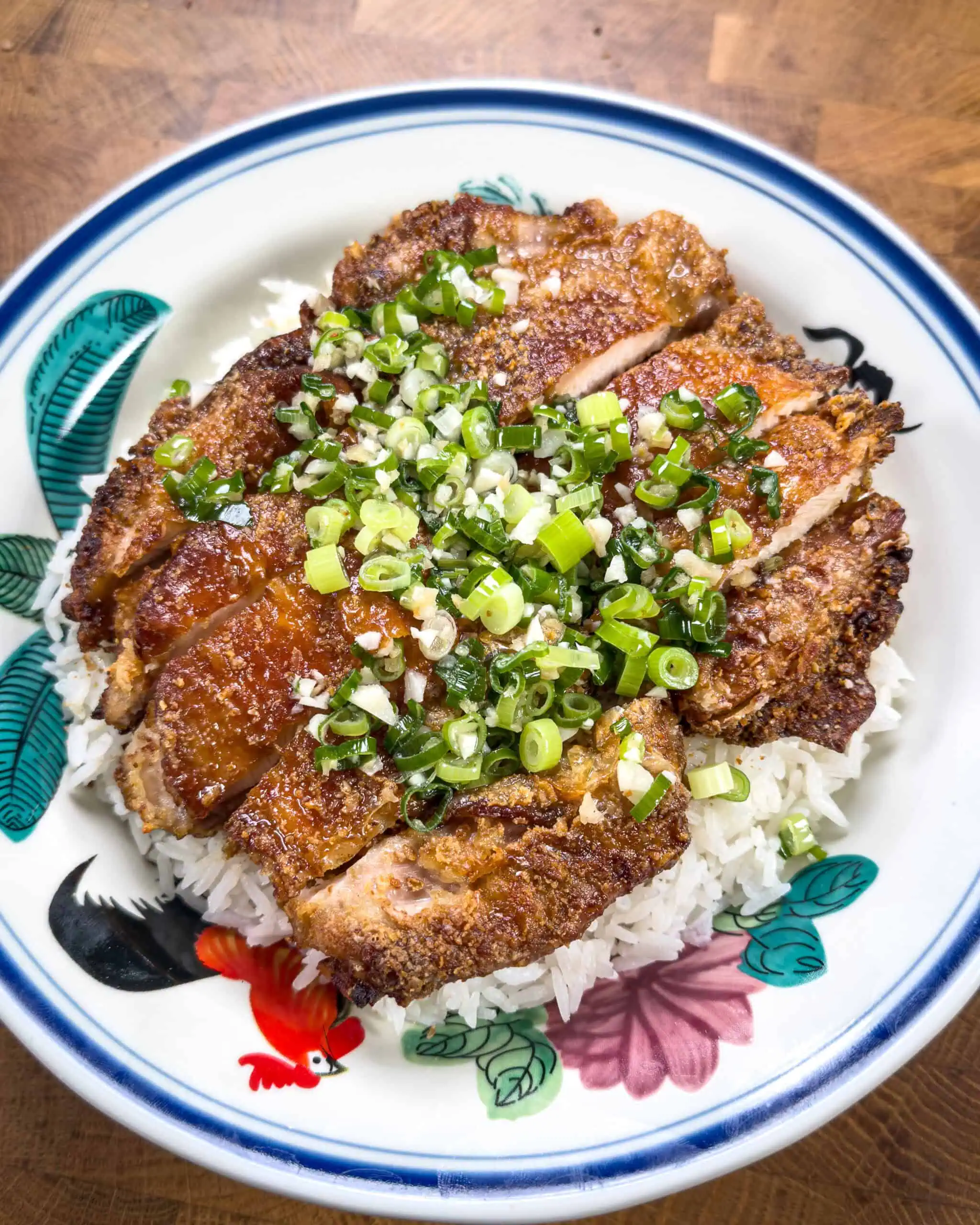 Crispy chicken served over rice with ginger scallion oil - GENIUS EATS Crispy chicken served over rice with ginger scallion oil