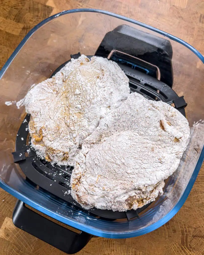 Marinated chicken thighs coated with cornstarch before air frying - GENIUS EATS Marinated chicken thighs coated with cornstarch before air frying