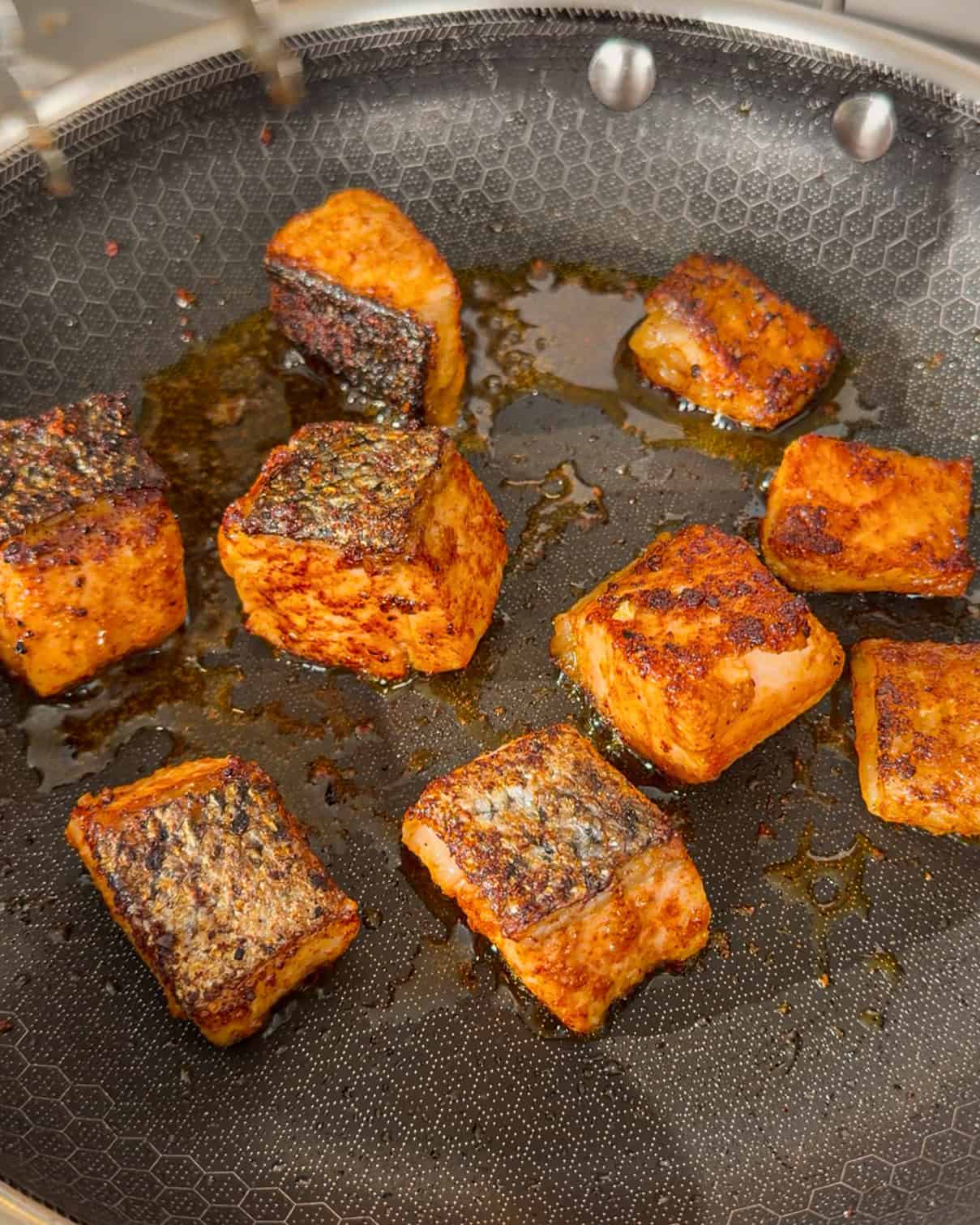 Pan-cooked salmon cubes with browned skin