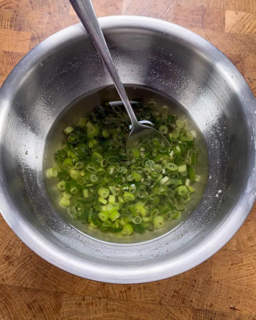 Scallions infused in hot oil to make ginger scallion oil - GENIUS EATS Scallions infused in hot oil to make ginger scallion oil