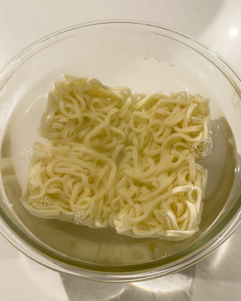 Udon noodles soaking in liquid