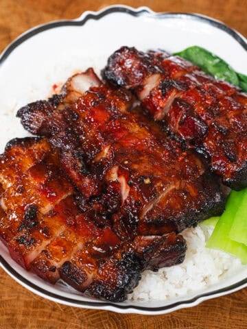 Delicious glazed BBQ ribs cooked in an air fryer, showcasing crispy edges and tender meat. Perfect f.