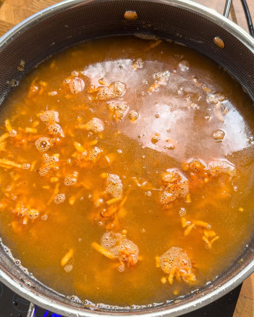 Curry liquid simmering in pan