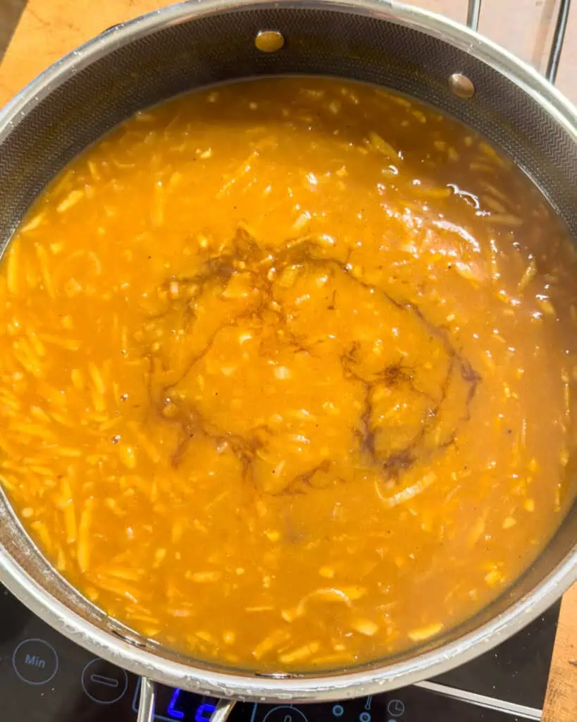 Immersion blender blending curry sauce until smooth - GENIUS EATS Immersion blender blending curry sauce until smooth