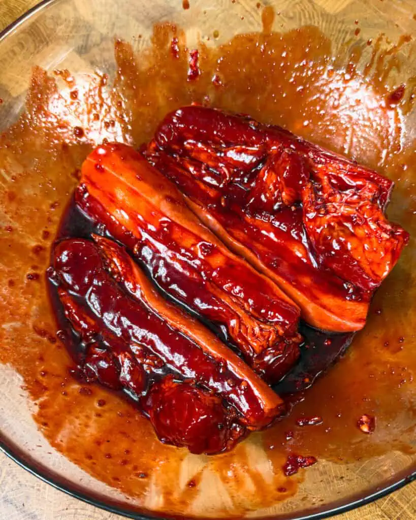 Marinated pork belly coated evenly in sauce before cooking Char Siu Pork Belly - GENIUS EATS Marinated pork belly coated evenly in sauce before cooking Char Siu Pork Belly