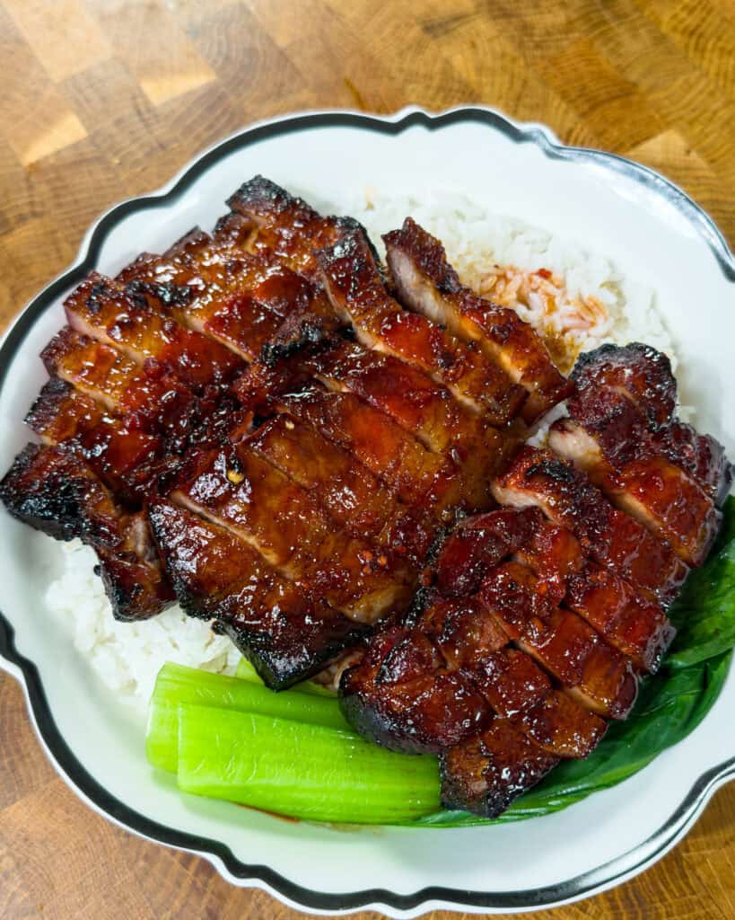 Sliced Char Siu Pork Belly served over white rice with Chinese broccoli