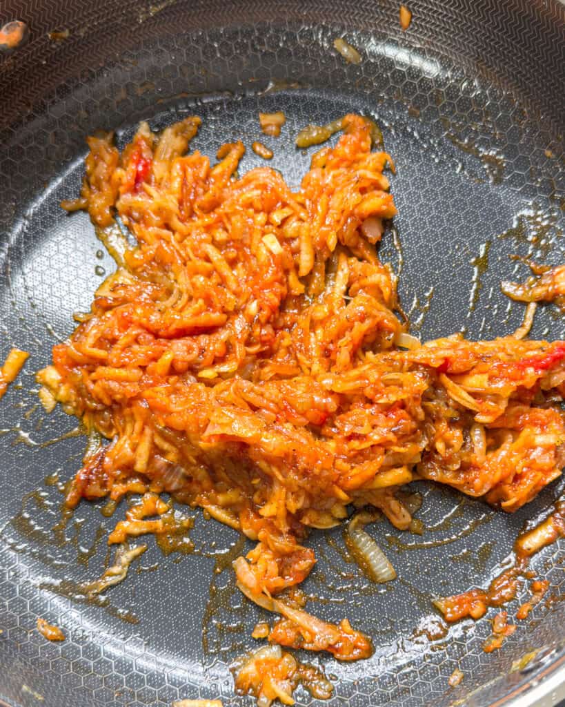 Thick curry base mixture cooking in pan