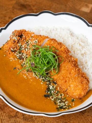 Delicious homemade caramel sauce simmering in a pan. Perfect for desserts and sweet treats.