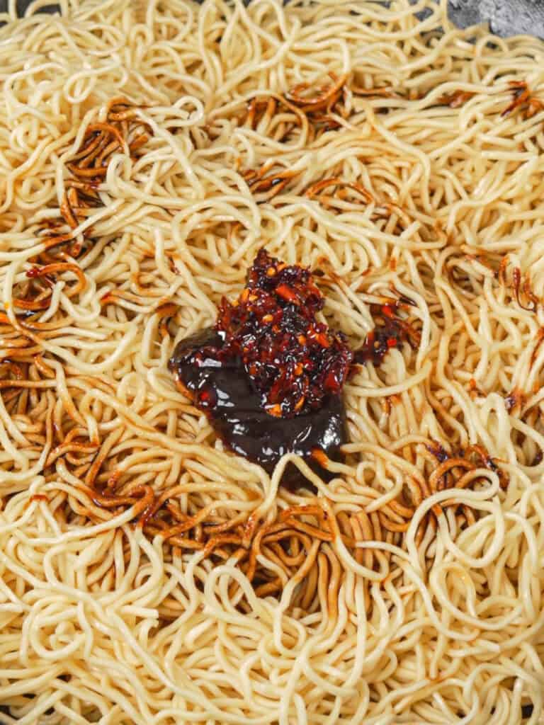Sweet and savory General Tso-style sauce mixture added over cooked chow mein noodles.