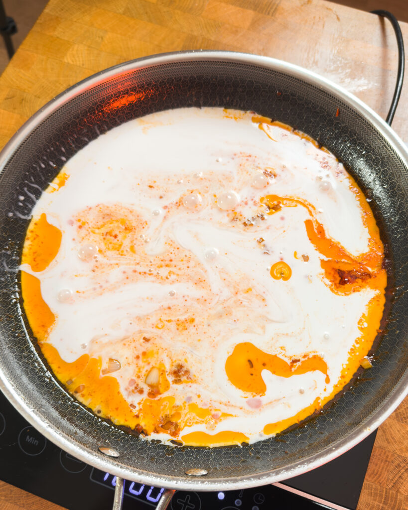 White liquid added to orange pan sauce - GENIUS EATS White liquid added to orange pan sauce