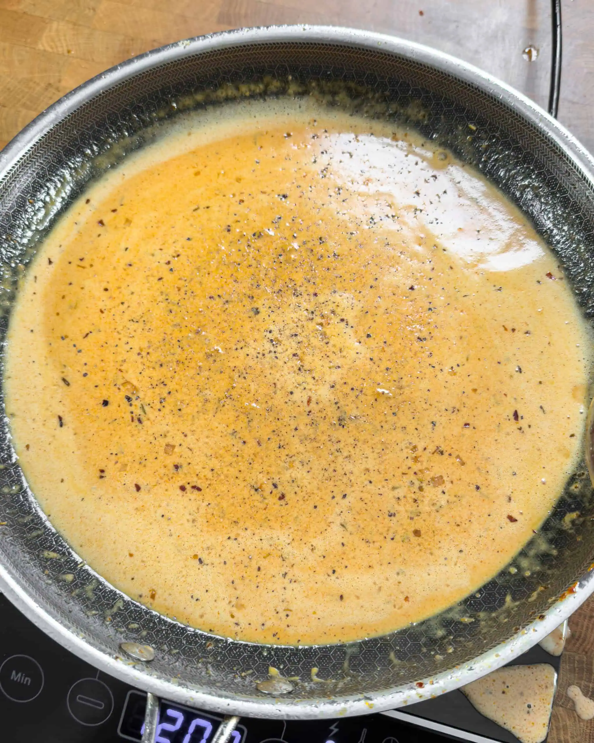 Smooth gochujang cream alfredo sauce in a pan - GENIUS EATS Smooth gochujang cream alfredo sauce in a pan